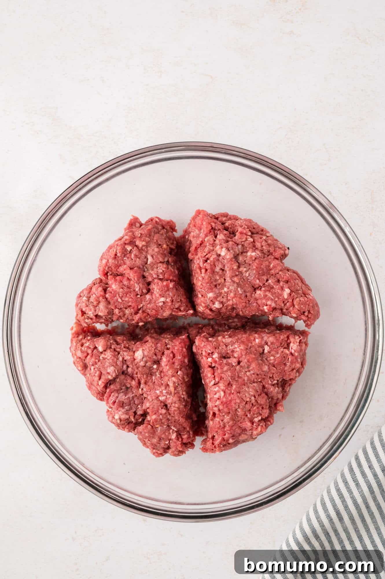 The Cali Dream Burger 7 The seasoned burger mixture divided into four equal portions, ready for shaping.