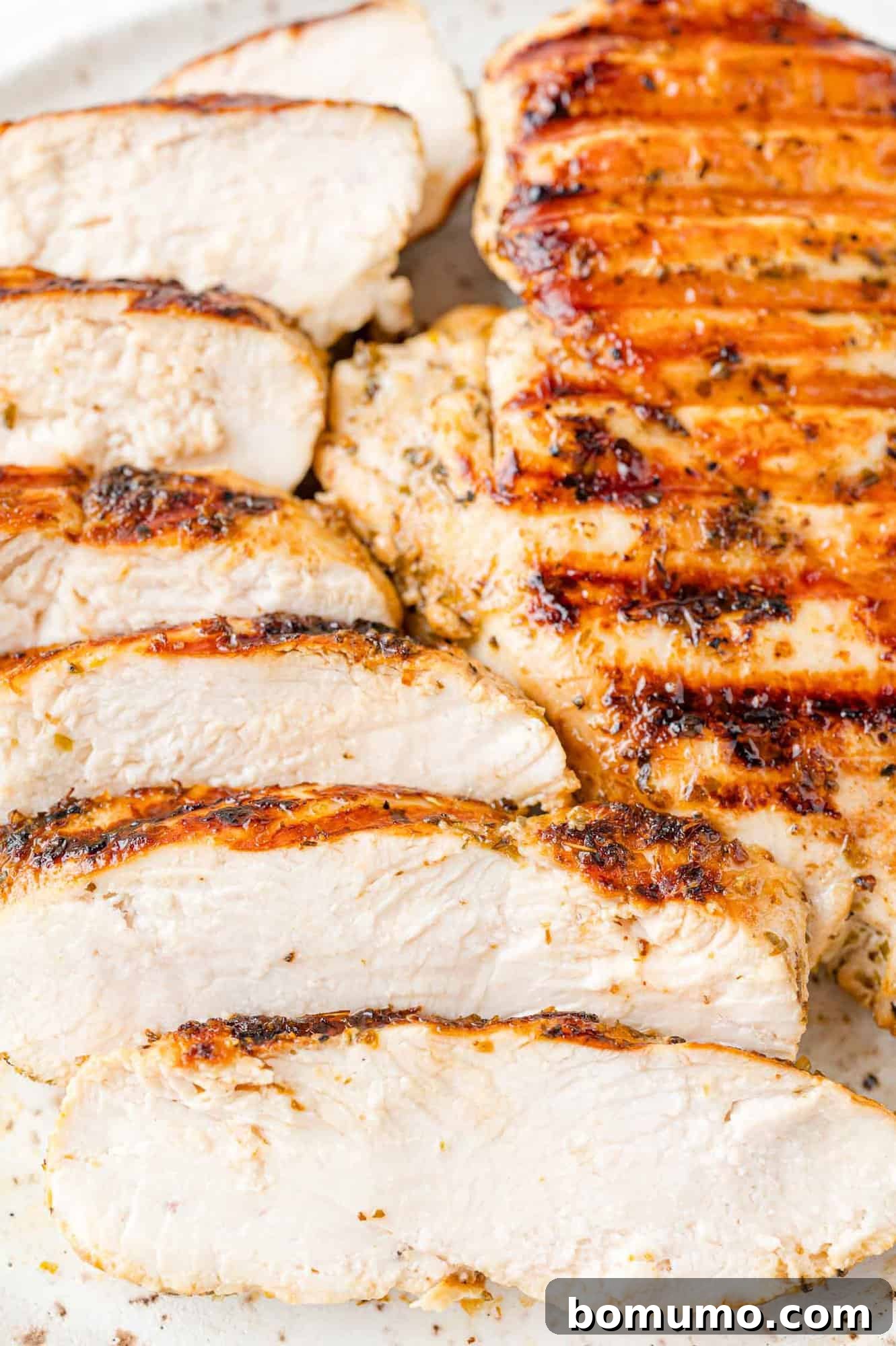 Grilled chicken, cut in to slices, served with fresh herbs.
