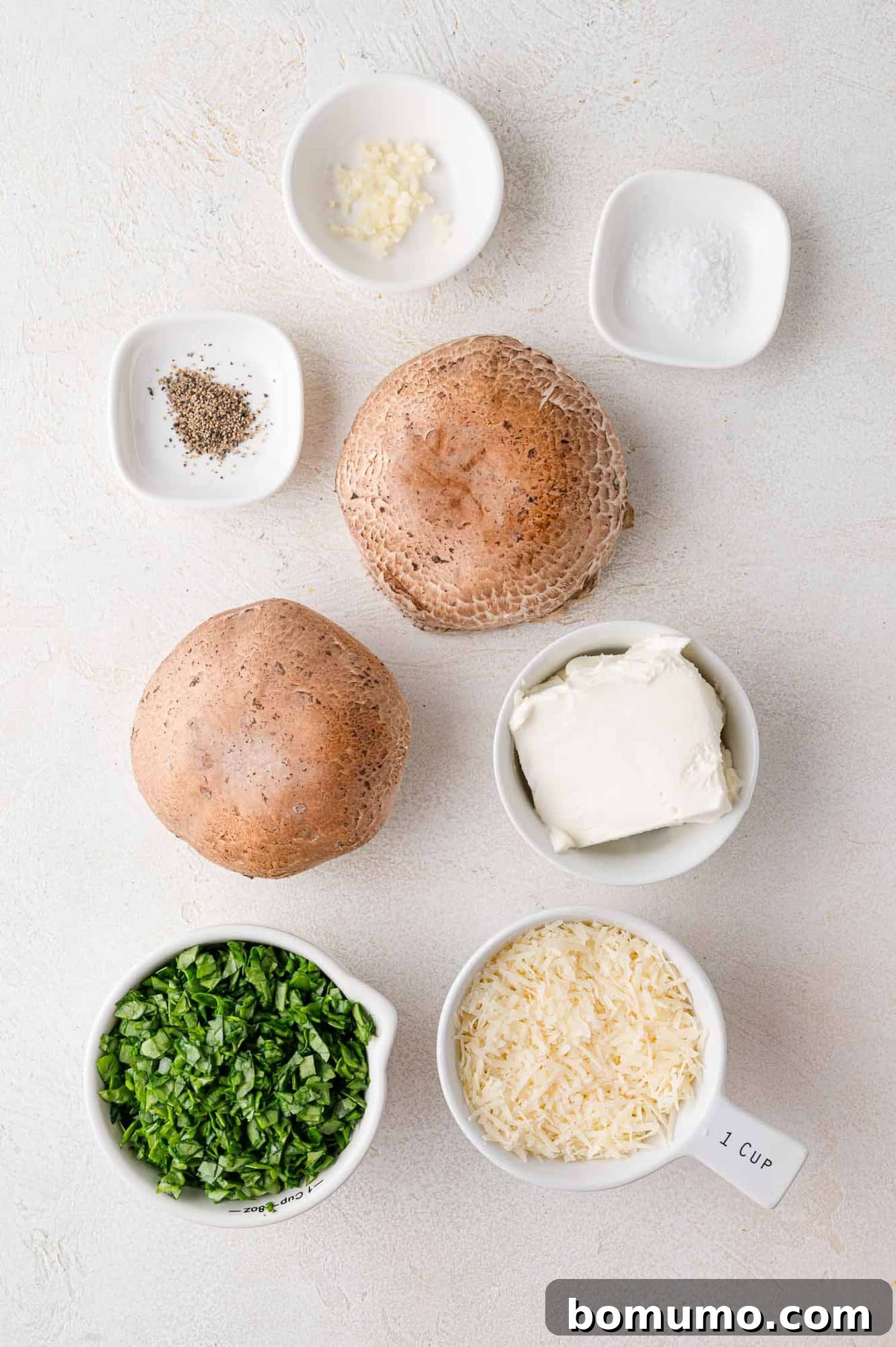 Ingredients needed for grilling portobello mushrooms with a cheesy filling.