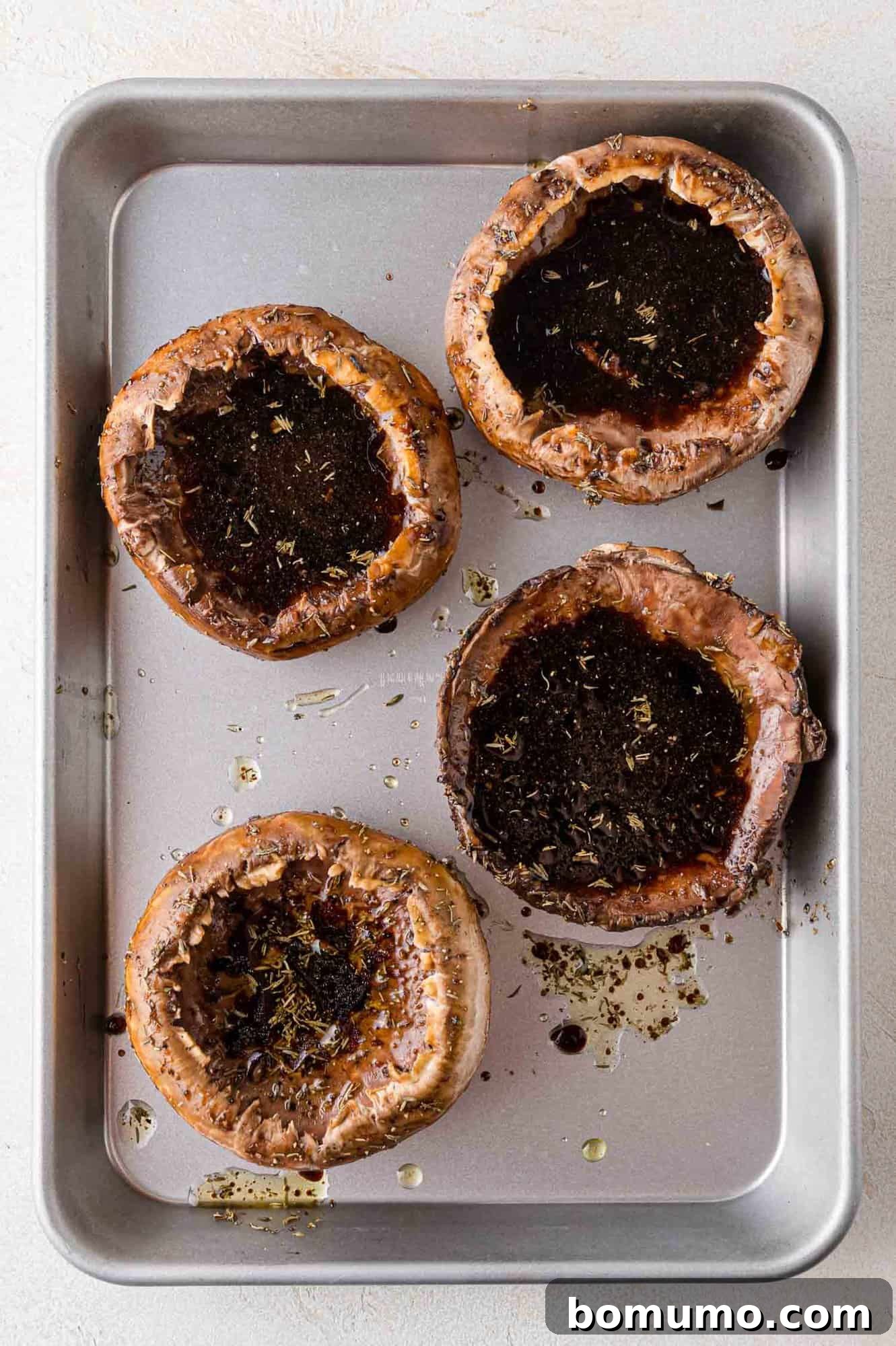 Marinating mushrooms arranged in a shallow dish.