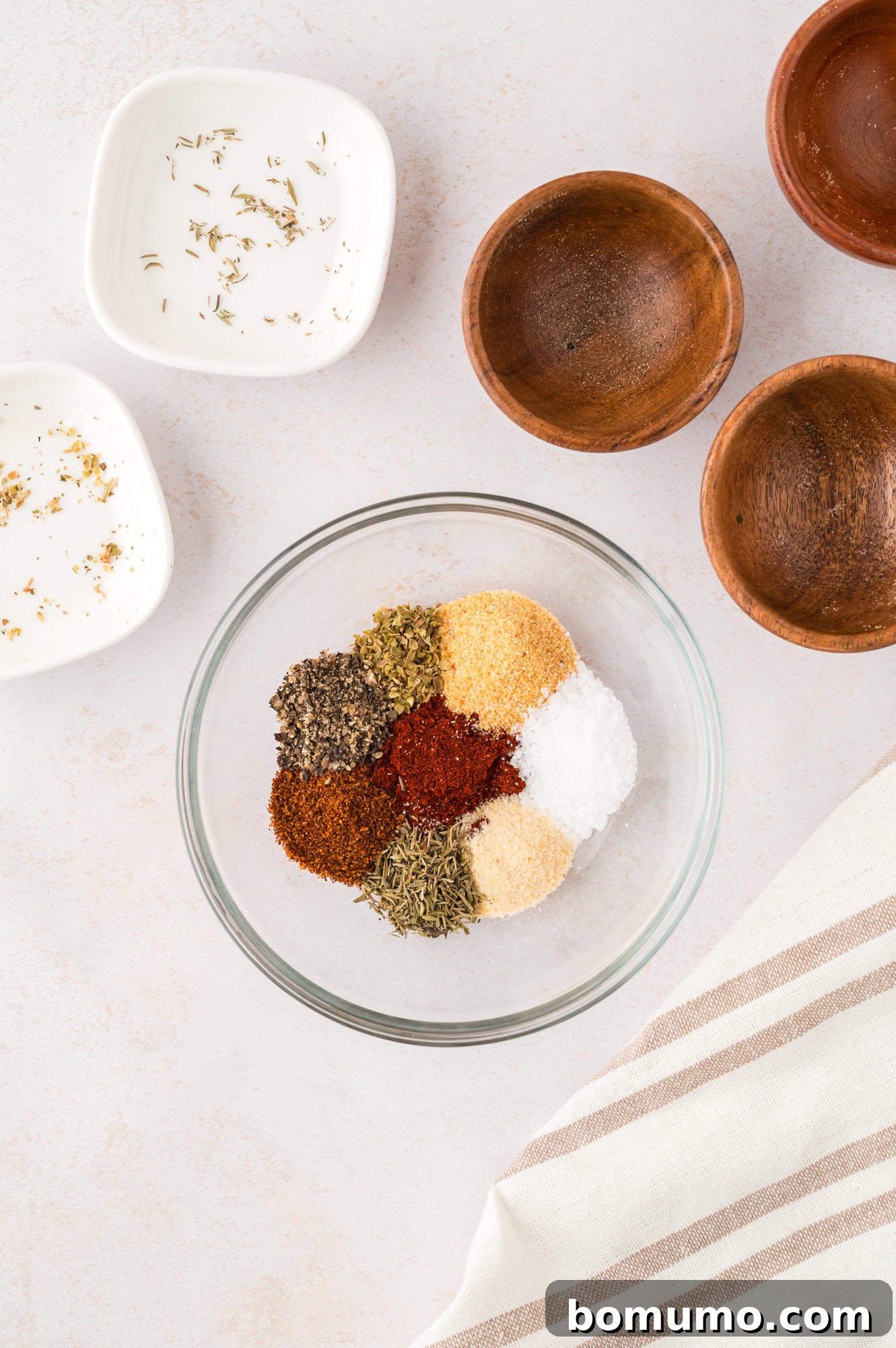 Spices in a bowl, not yet mixed together.