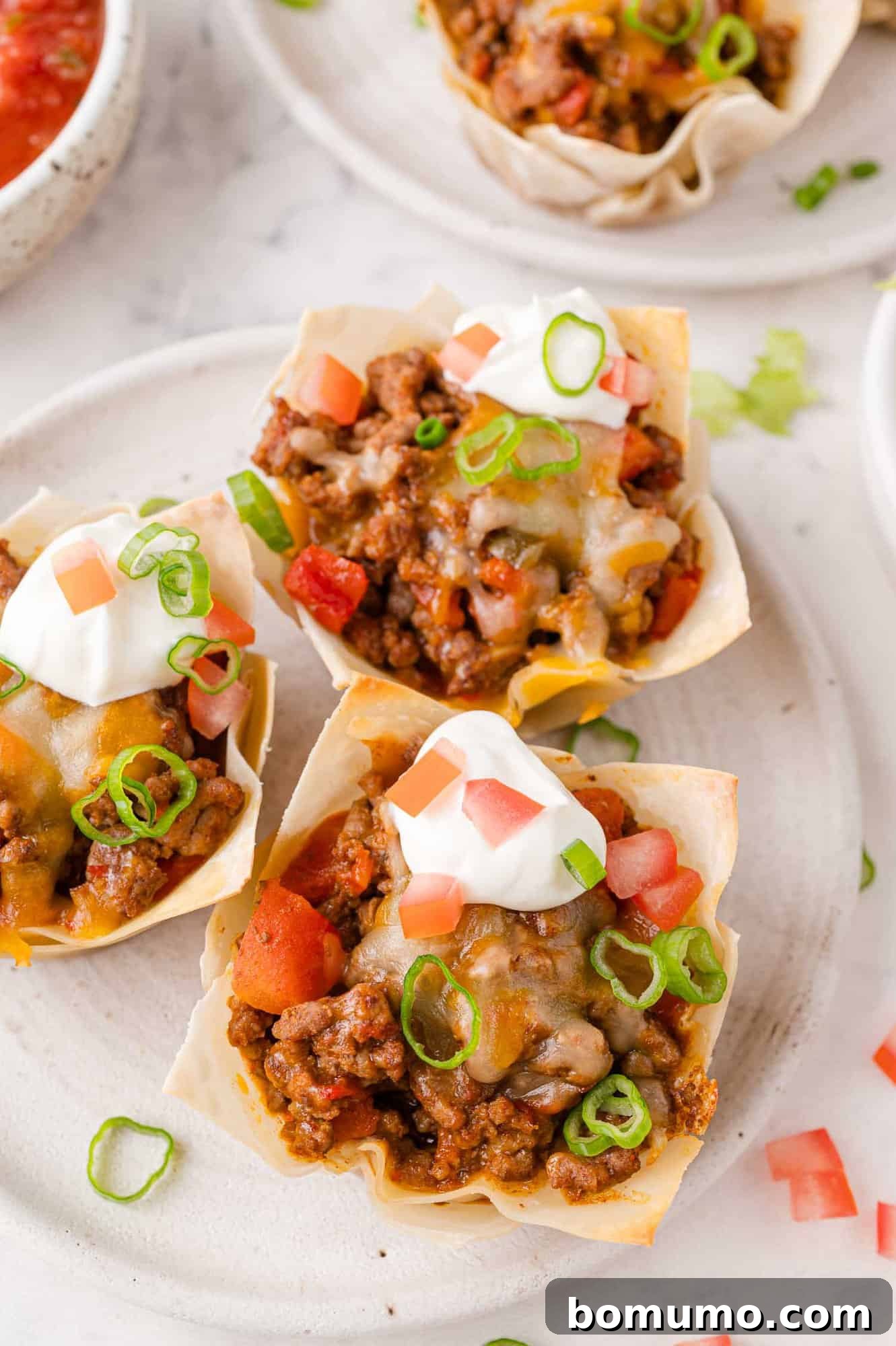 Taco cups with toppings.