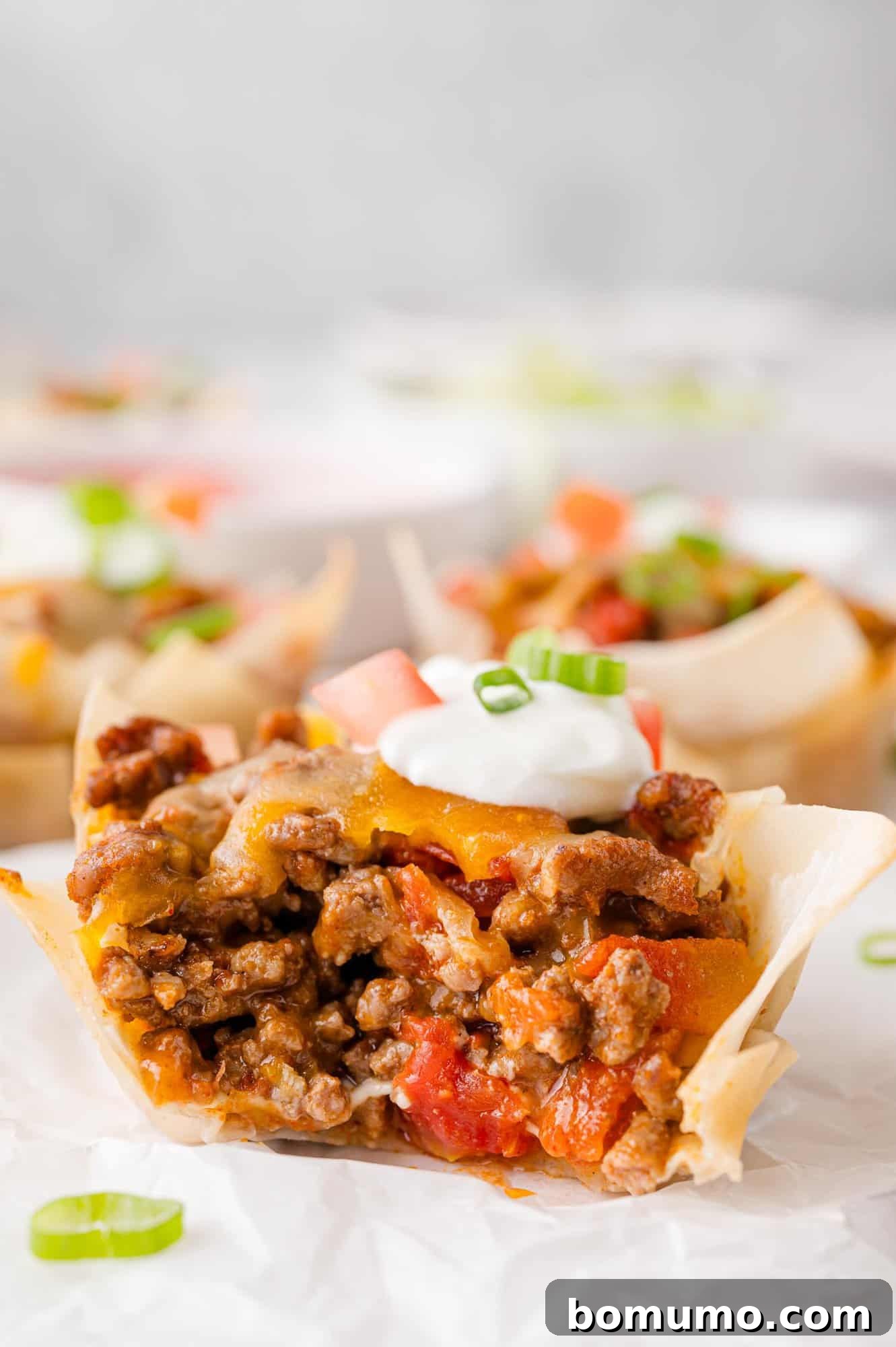 Taco cup with a bite taken to show filling.