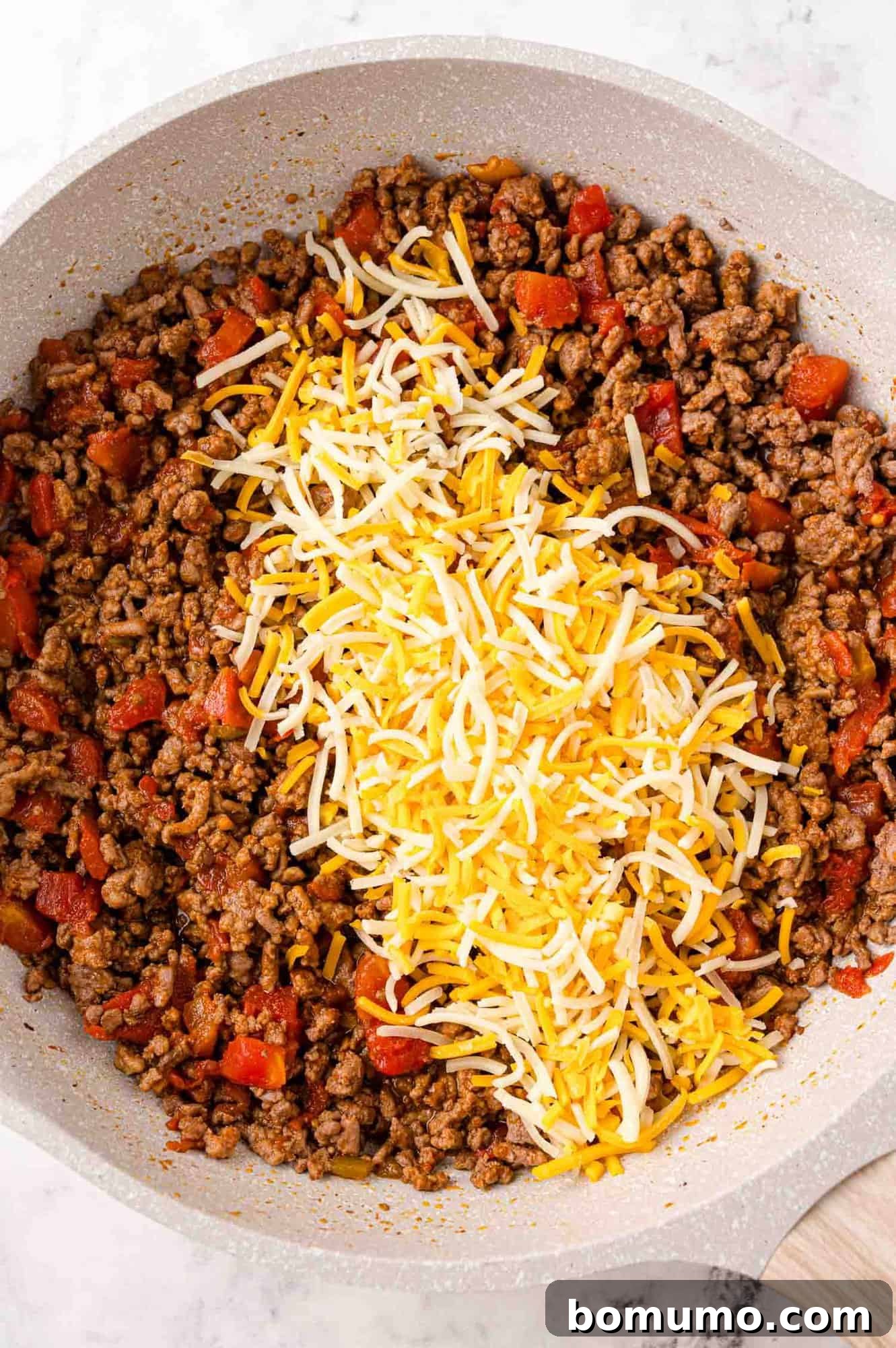 Cheese added to meat mixture.