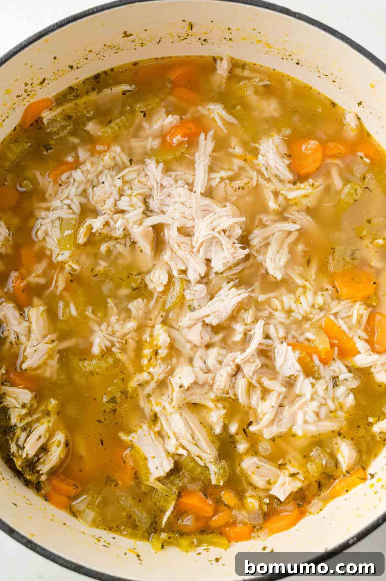 Shredded chicken added back to soup.