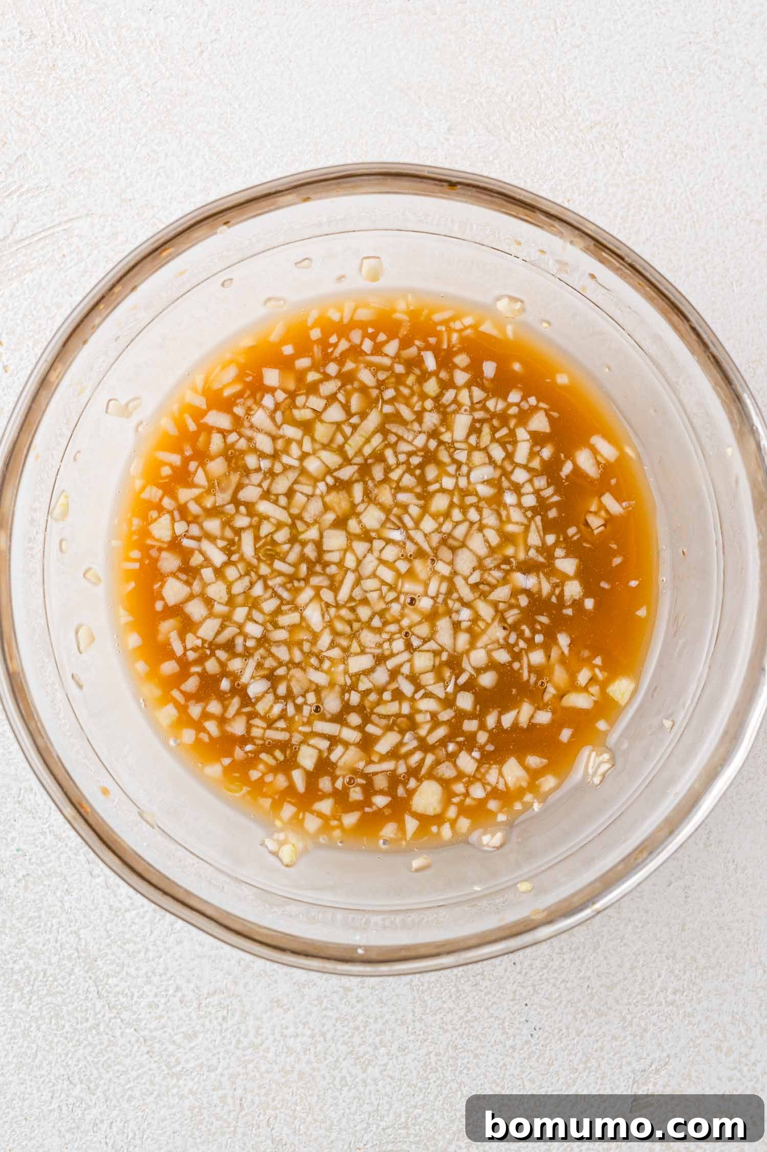 Honey garlic sauce mixed up in a bowl, ready to be added.