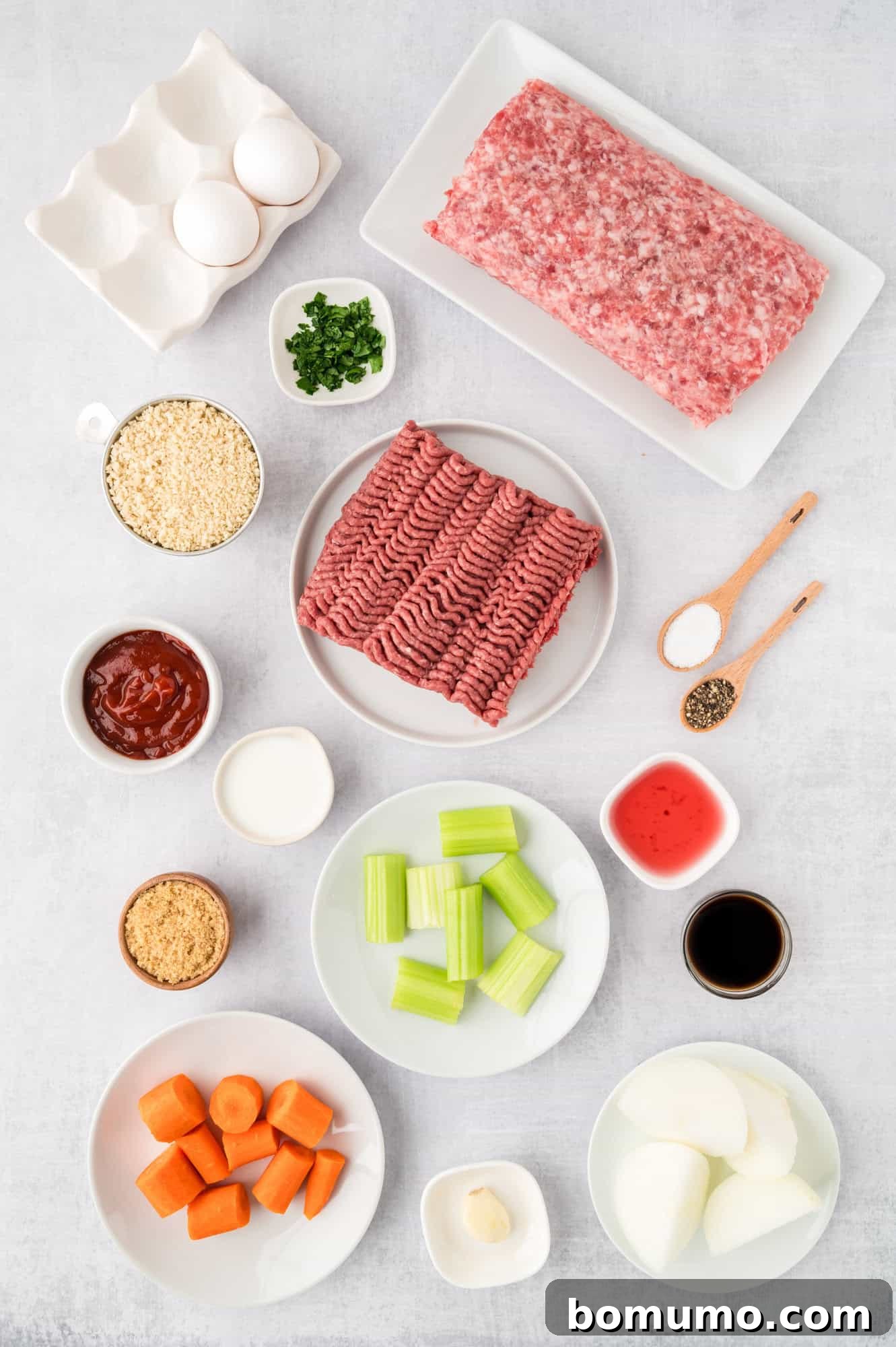An overhead view showcasing all the fresh, high-quality ingredients needed for this crockpot meatloaf recipe, laid out neatly on a kitchen counter.
