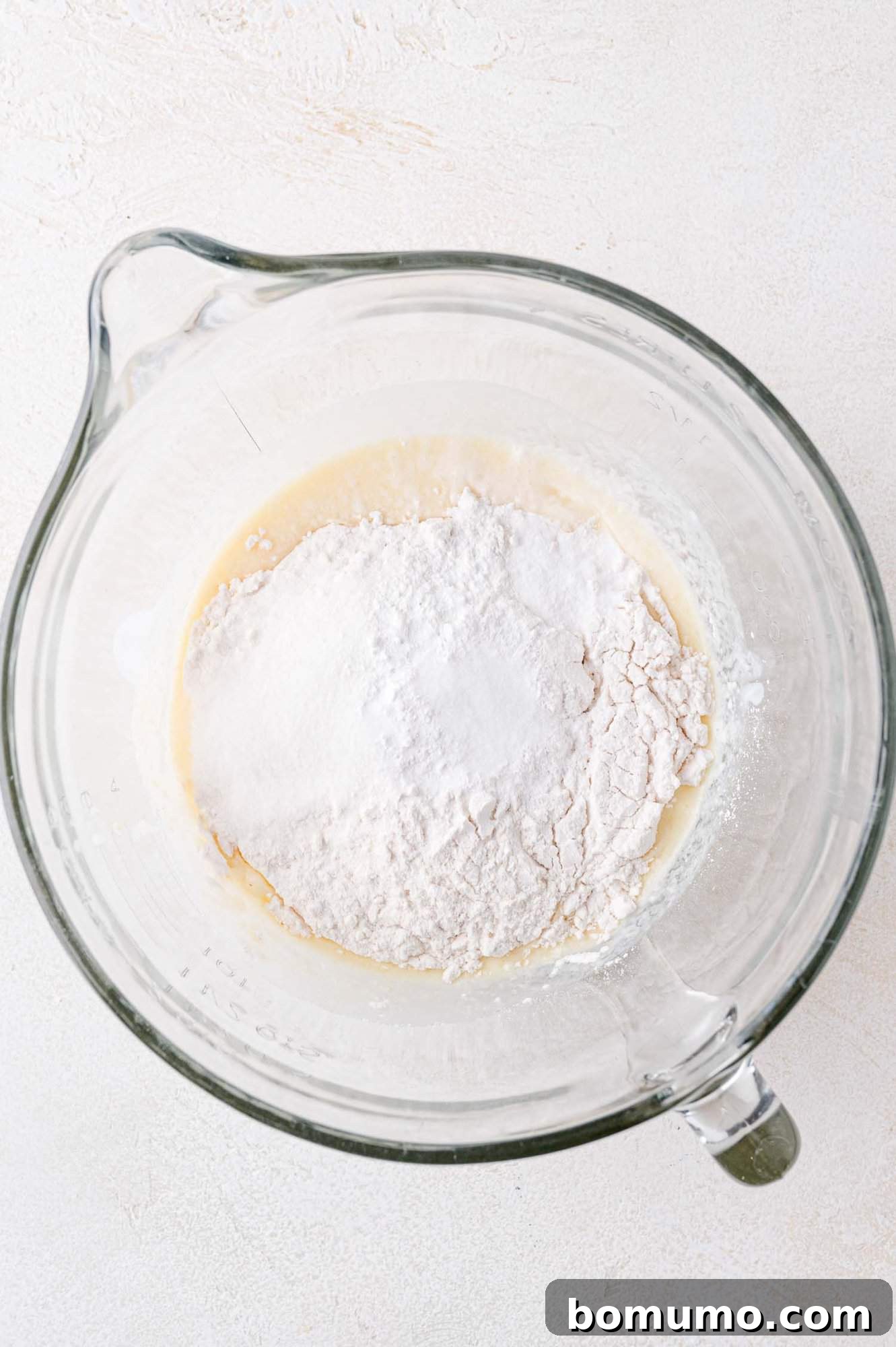 Dry ingredients, on top of wet ingredients.