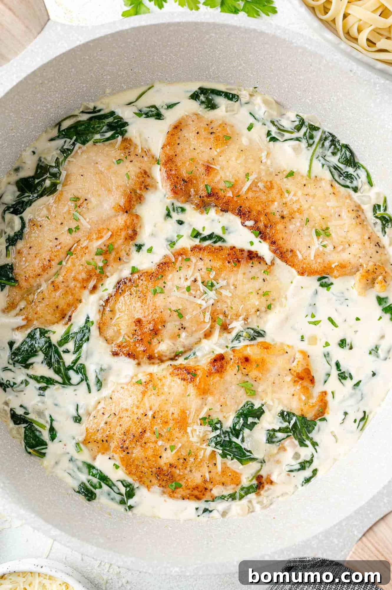 Silken Florentine Chicken 14 The golden-brown chicken cutlets gently returned to the skillet, nestled in the vibrant and creamy Florentine sauce.