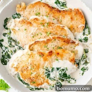 Chicken Florentine in a skillet, with a spinach cream sauce.