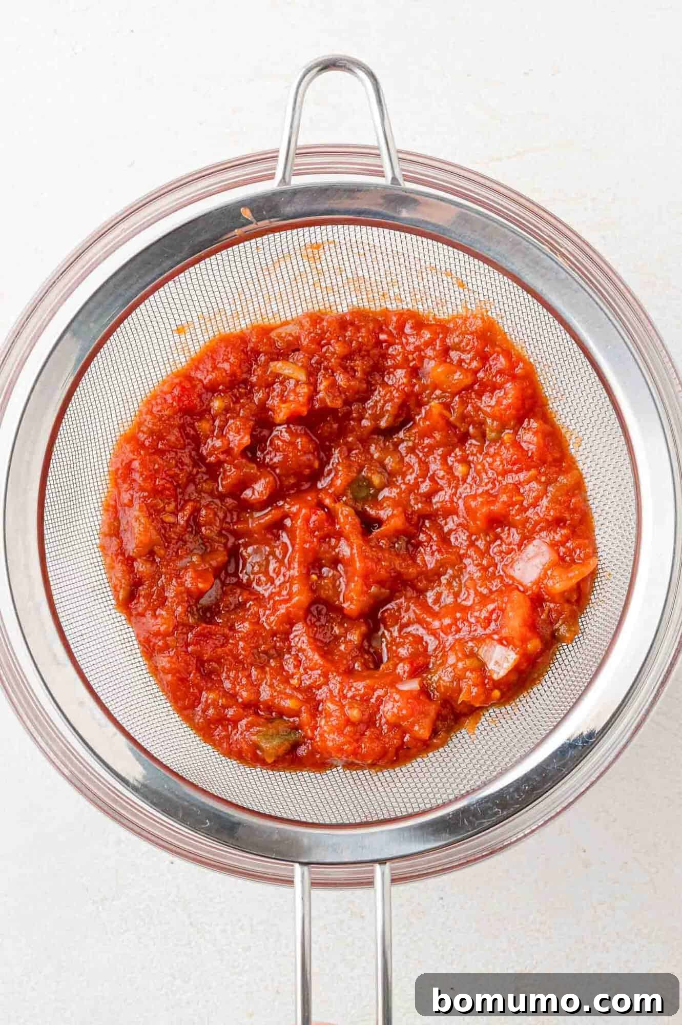 Simple Two Ingredient Cranberry Salsa 5 Salsa being drained.
