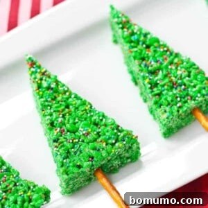 Christmas trees on rectangular white plate, on red background.