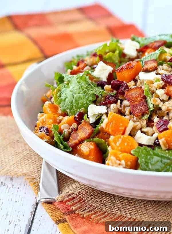 Front partial closeup of a beautifully presented farro salad nestled in a shallow white bowl, highlighting its rich textures and inviting colors.