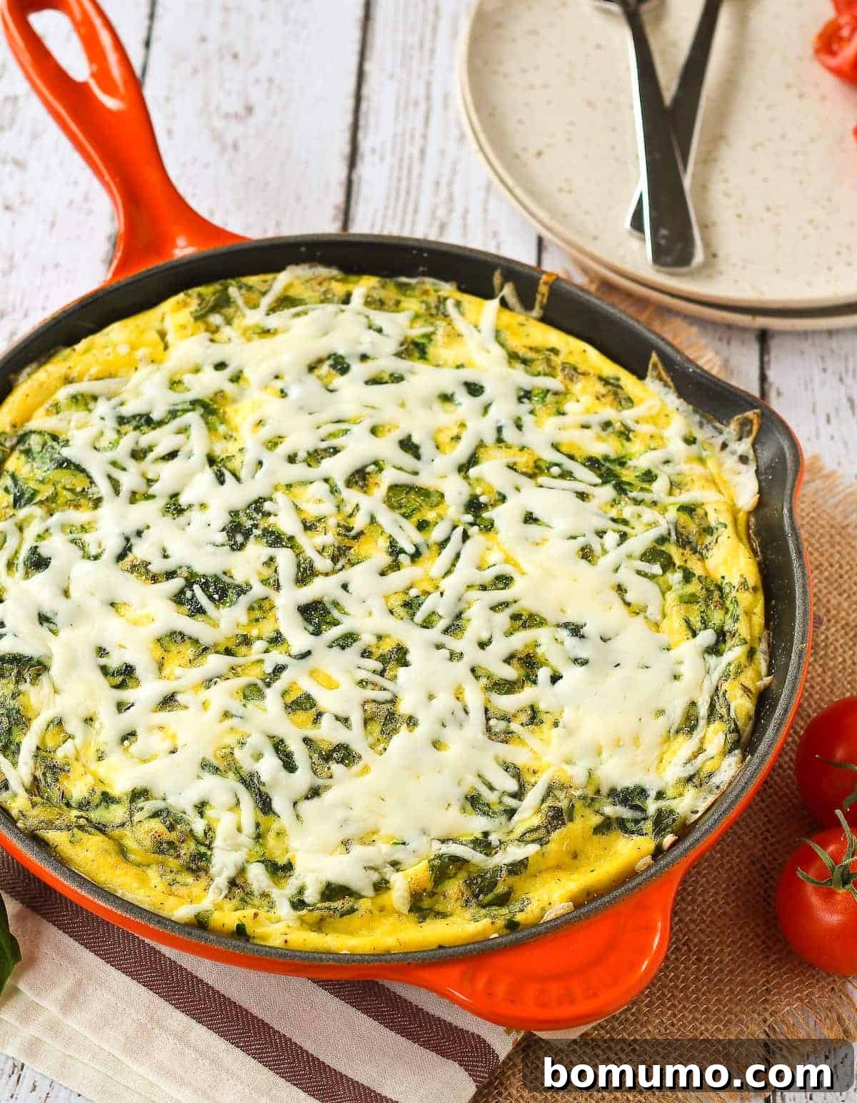 A vibrant White Pizza Frittata served in an orange skillet, ready for brunch.