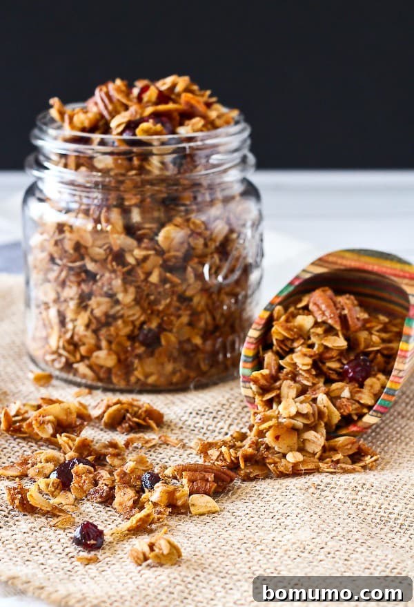 Granola in a jar and in a scoop.