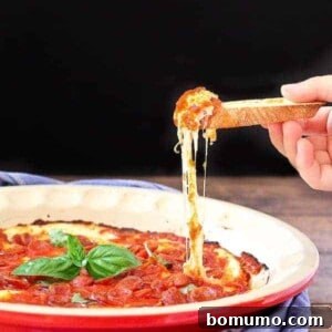 Imagine irresistible pepperoni pizza in dip form. I can't think of many things better than that. This pepperoni pizza dip will be a hit at all your parties. Get the easy appetizer recipe on RachelCooks.com!
