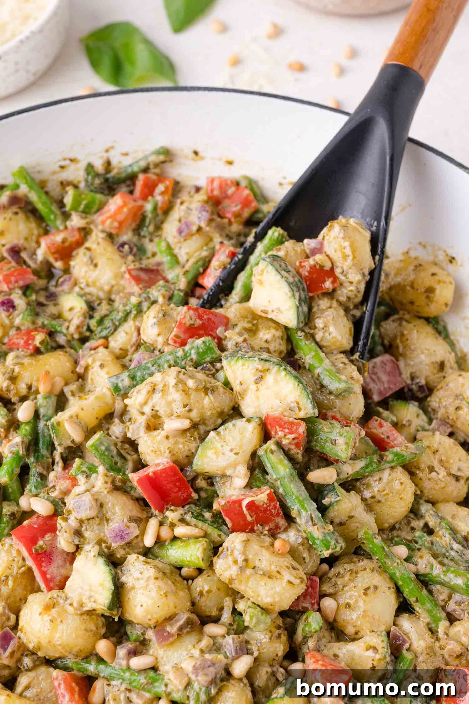 Pesto Gnocchi Delight 2 A bowl of pesto gnocchi with vegetables