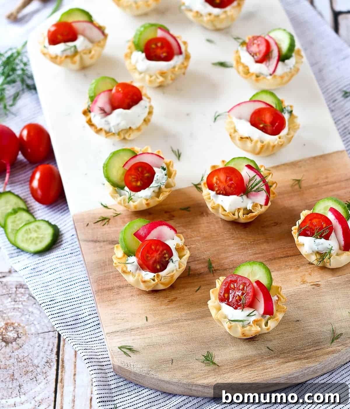Spring appetizer cups with tomato, radish, and cucumber.