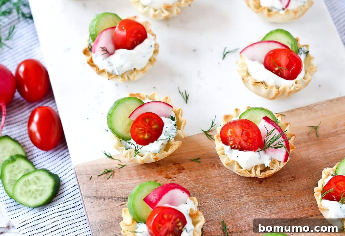 Cream cheese and spring vegetables in phyllo cups.