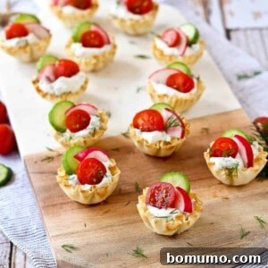 These spring herb cream cheese appetizer cups scream spring flavors and are easy to make - they come together in minutes they are a stunning addition to any appetizer spread.