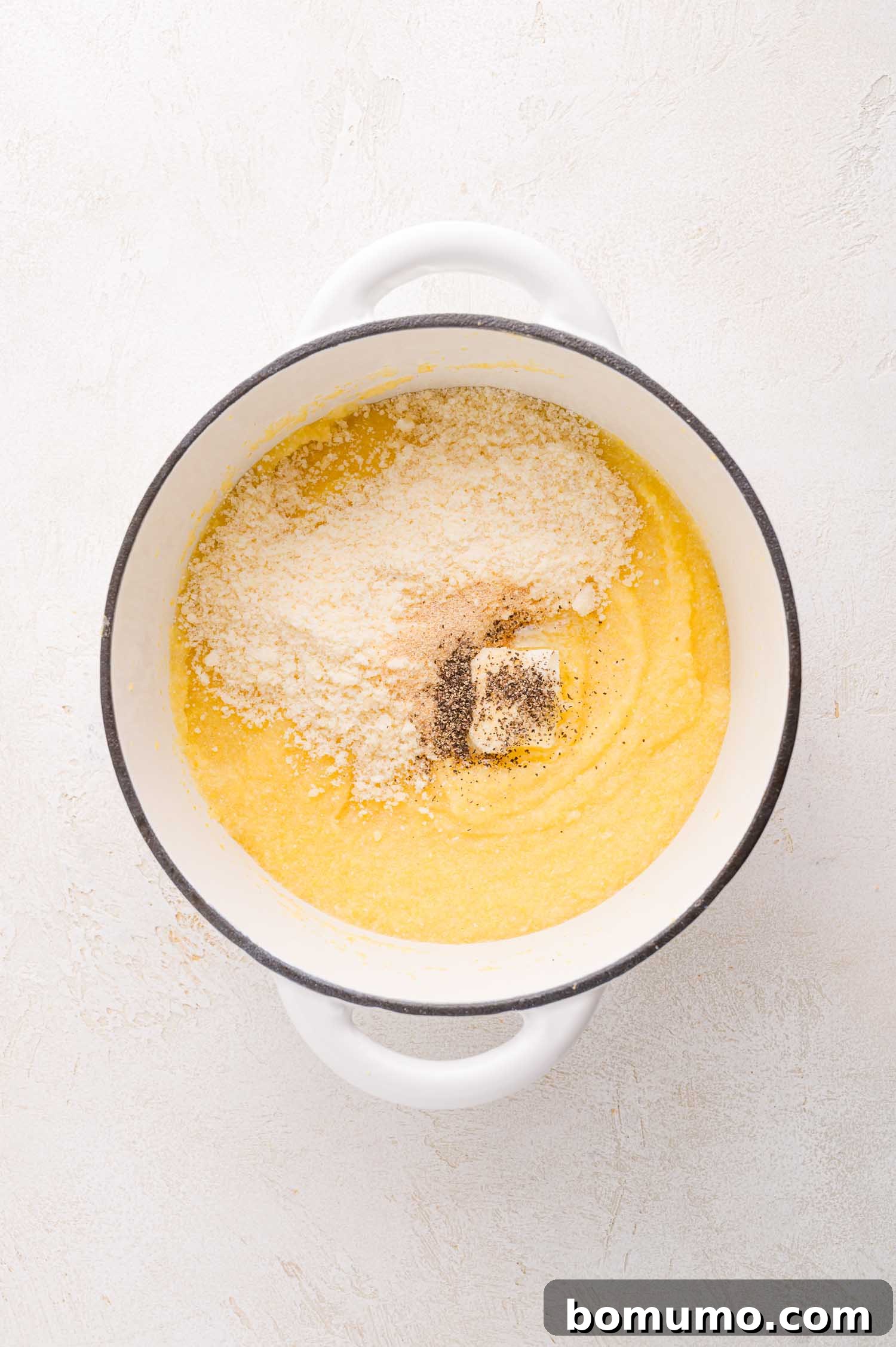 Cooked polenta with cheese and butter.