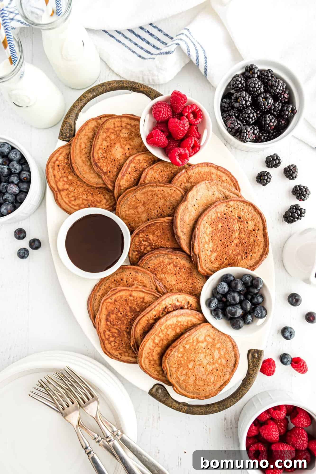 A beautiful platter of fluffy chocolate protein pancakes, ready to be enjoyed.