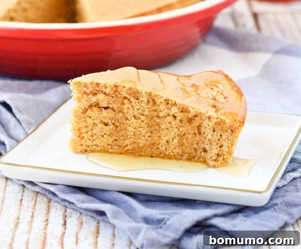 Healthy whole wheat cornbread served on a rectangular plate, ready to be enjoyed.