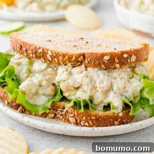 Appetizing chickpea salad sandwich on wholesome wheat bread, a perfect vegetarian meal.