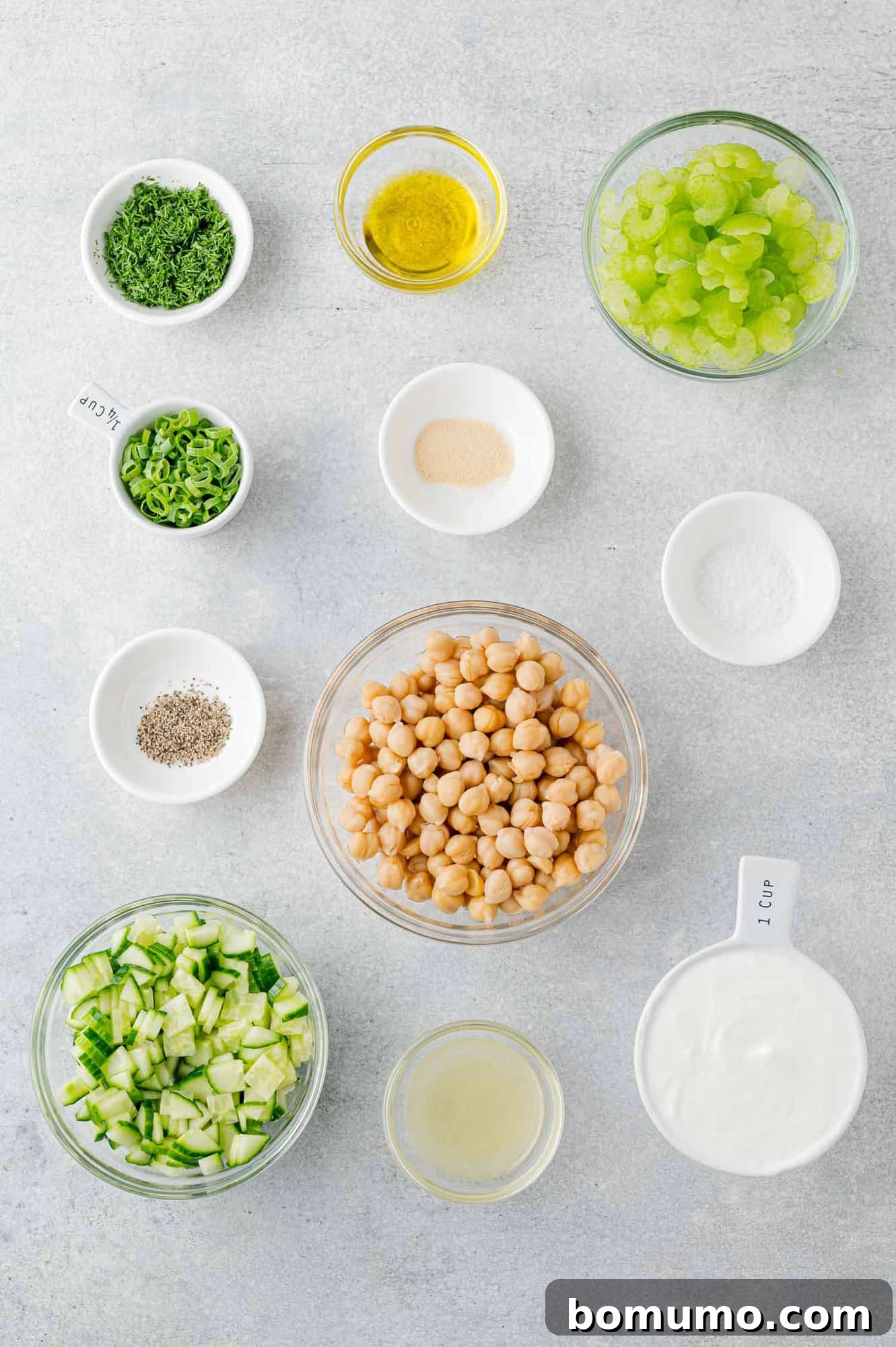Overhead view of all fresh ingredients laid out, ready for making the chickpea salad sandwich.