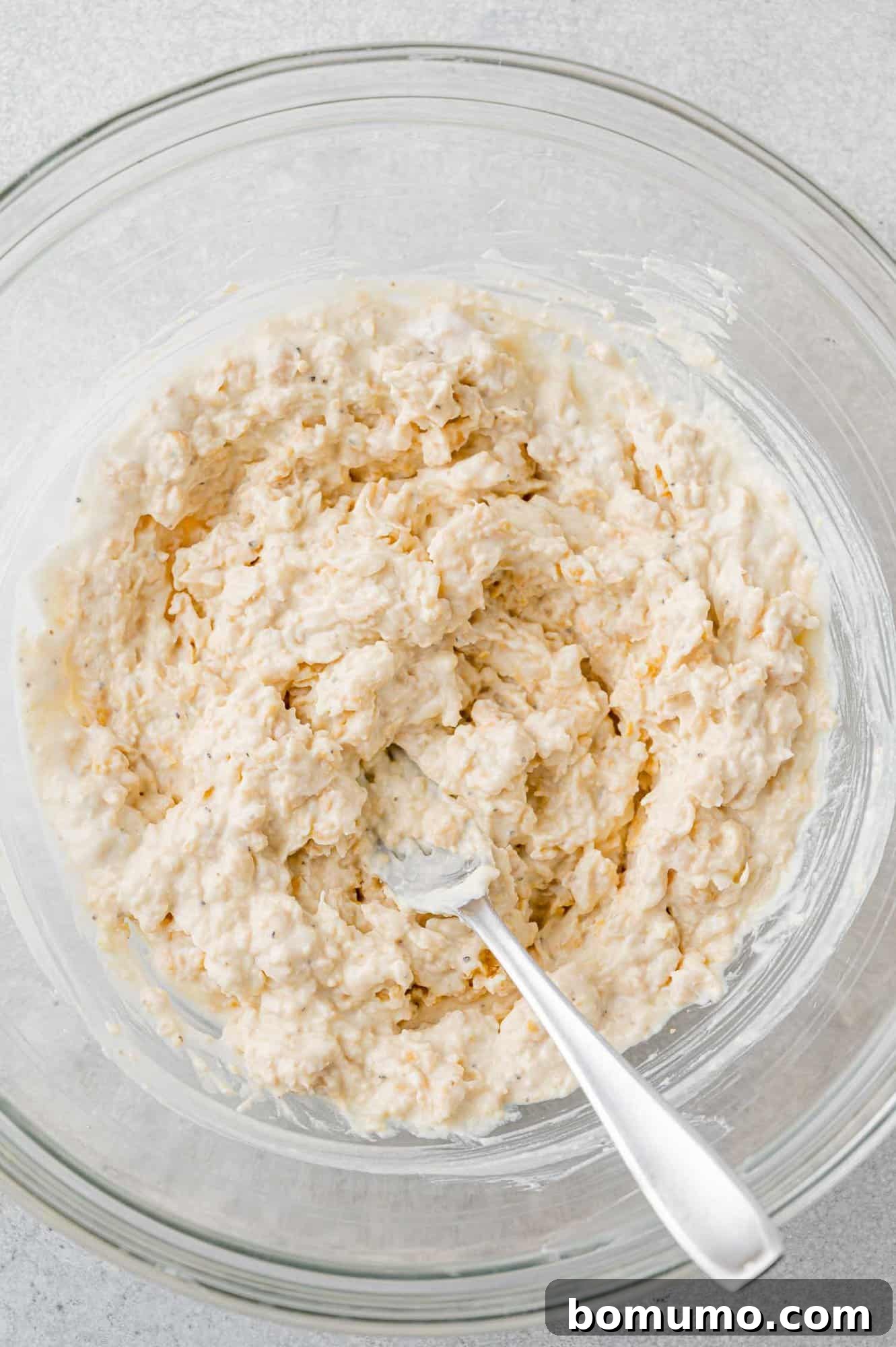 Close-up of the perfectly smashed chickpea mixture, ready for the next steps.