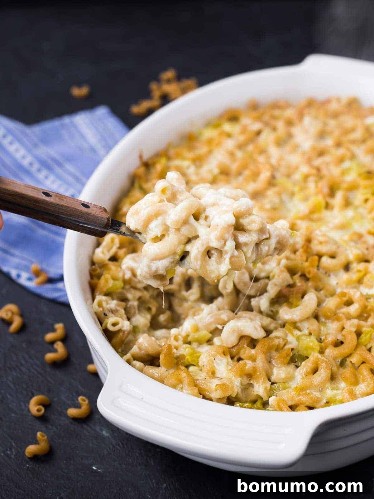 Southwest Mac Delight 2 Creamy green chile mac and cheese in a white casserole dish, fresh from the oven and ready to serve.