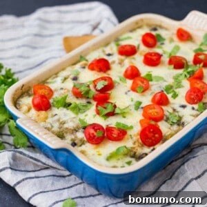 Baked quinoa casserole in blue rectangular baking dish.