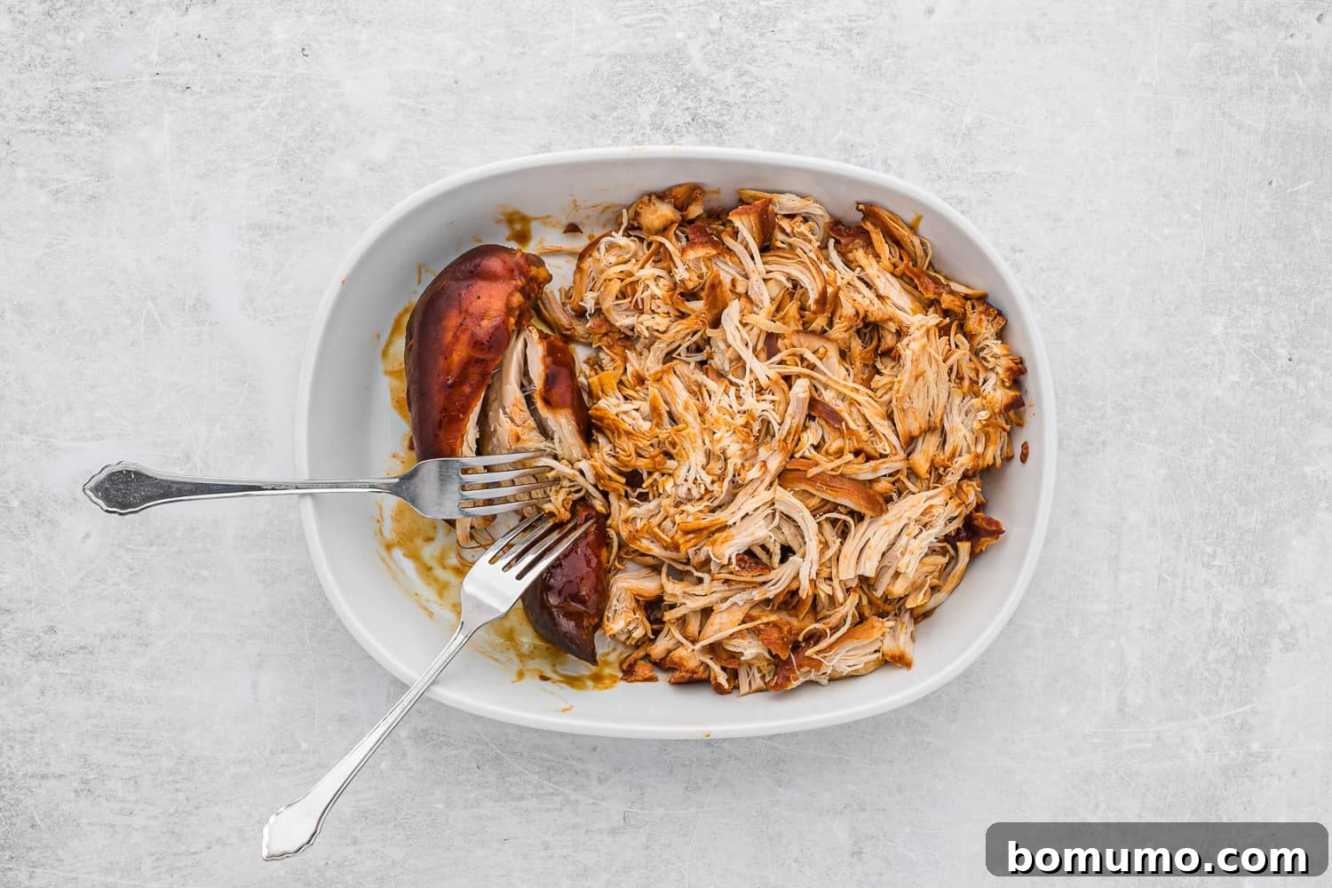 Chicken being shredded.