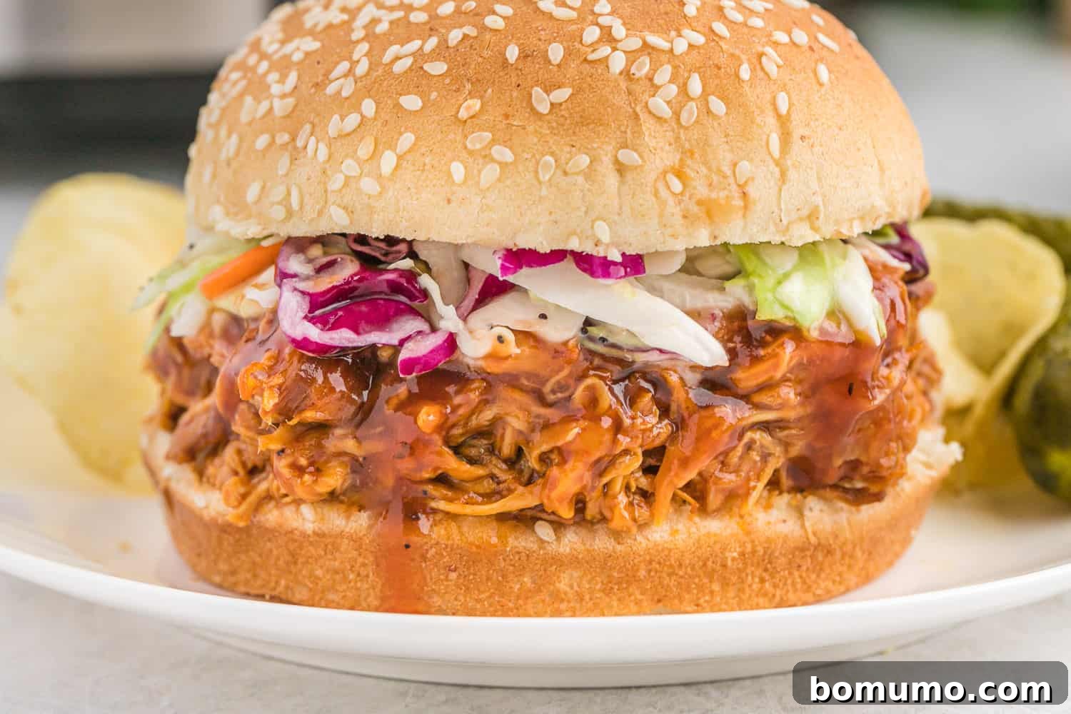 BBQ chicken on a sesame seed bun.
