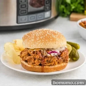 Crockpot bbq chicken on a bun.