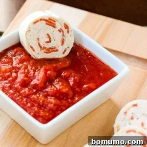 Quick Pepperoni Pizza Roll-Ups 4 Delightful pepperoni pizza tortilla pinwheels, a perfect make-ahead appetizer or lunchbox treat for kids and adults alike.