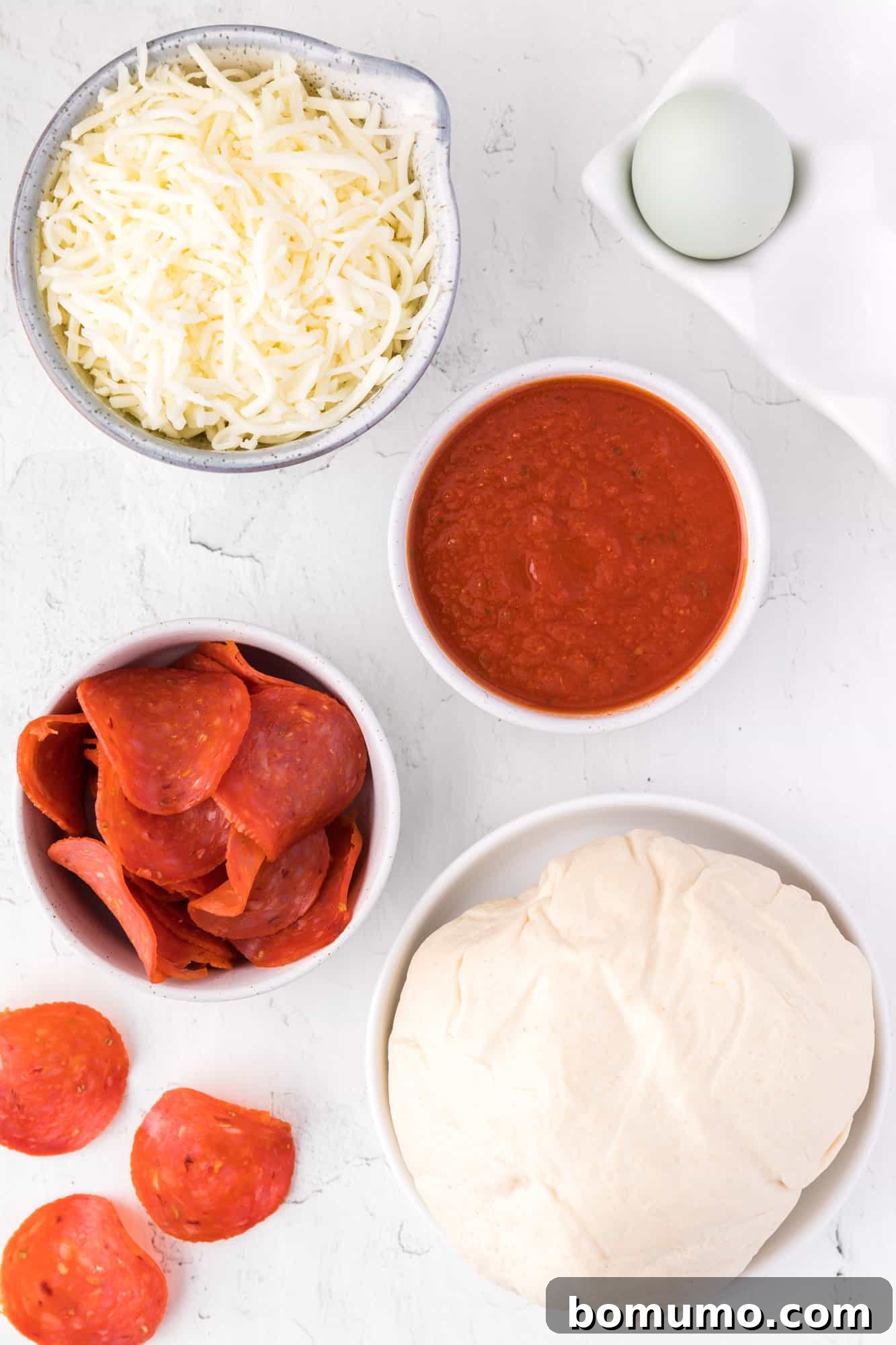Ingredients needed for hot pocket recipe, neatly arranged on a counter, ready for preparation.
