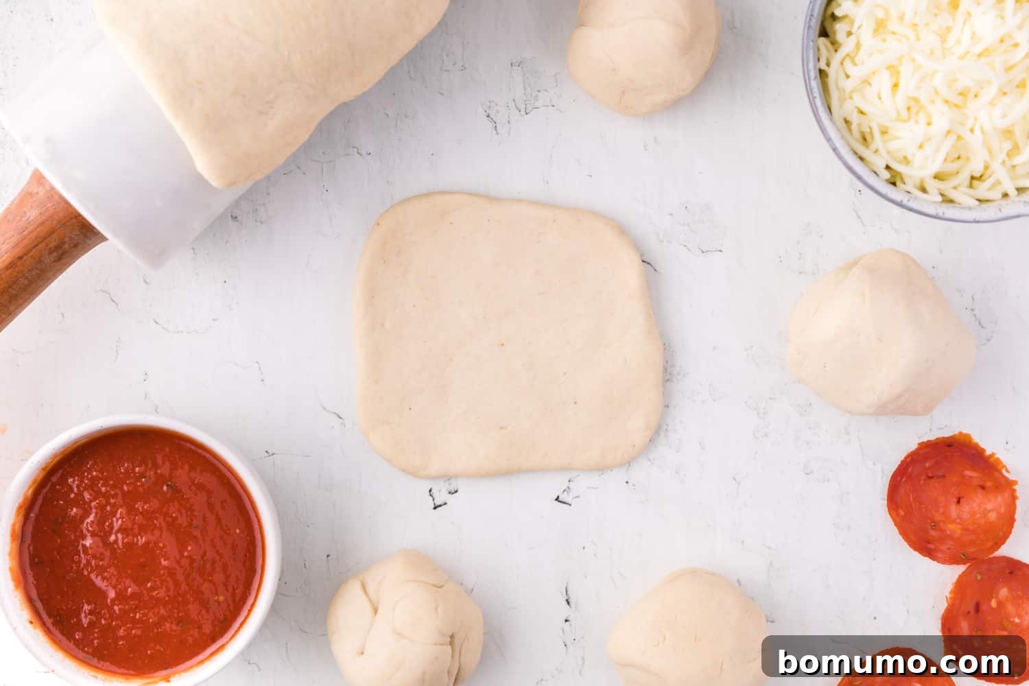 Dough rolled into a small, uniform circle, perfect for creating a homemade hot pocket.