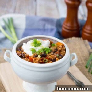 Extra filling and extra flavorful, this turkey quinoa chili is the perfect quick and easy weeknight meal -- and it freezes well! Get the healthy chili recipe on RachelCooks.com!