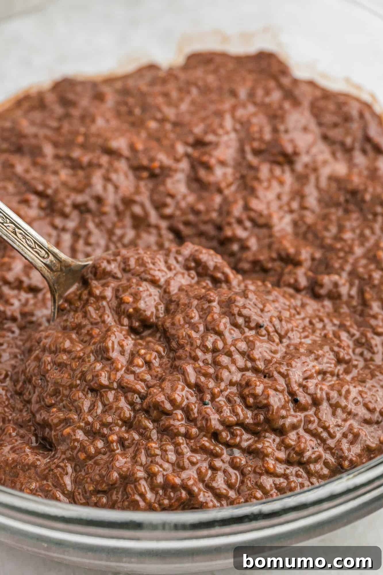 A close-up view of the perfectly gelled and creamy chocolate chia seed pudding, ready to be enjoyed.