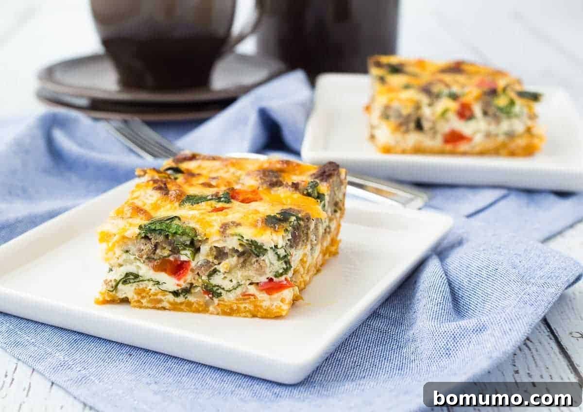 A perfectly square slice of golden-brown egg white casserole with visible sweet potato crust, nestled on a pristine white plate. The edges are crisp, and the interior is fluffy, showcasing a delicious and healthy breakfast option ready to be savored.