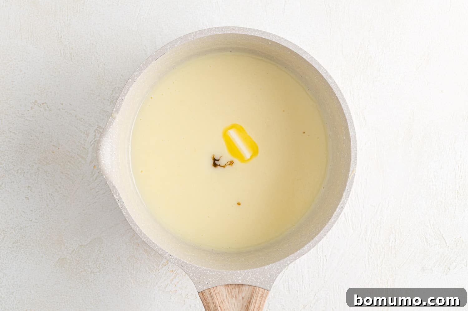 Dreamy Vanilla Pudding from Scratch 7 Butter and vanilla added to pudding.