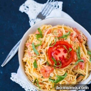 Fresh tomato cream sauce tossed with angel hair pasta, a perfect spring and summer pasta recipe.