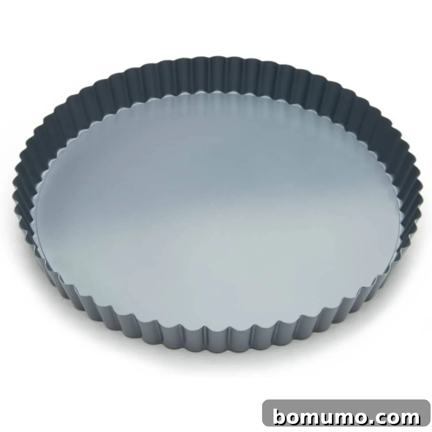 Tart pan product image, demonstrating its shallow depth and fluted sides.