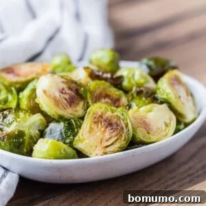 Maple cayenne roasted Brussels sprouts in small bowl.