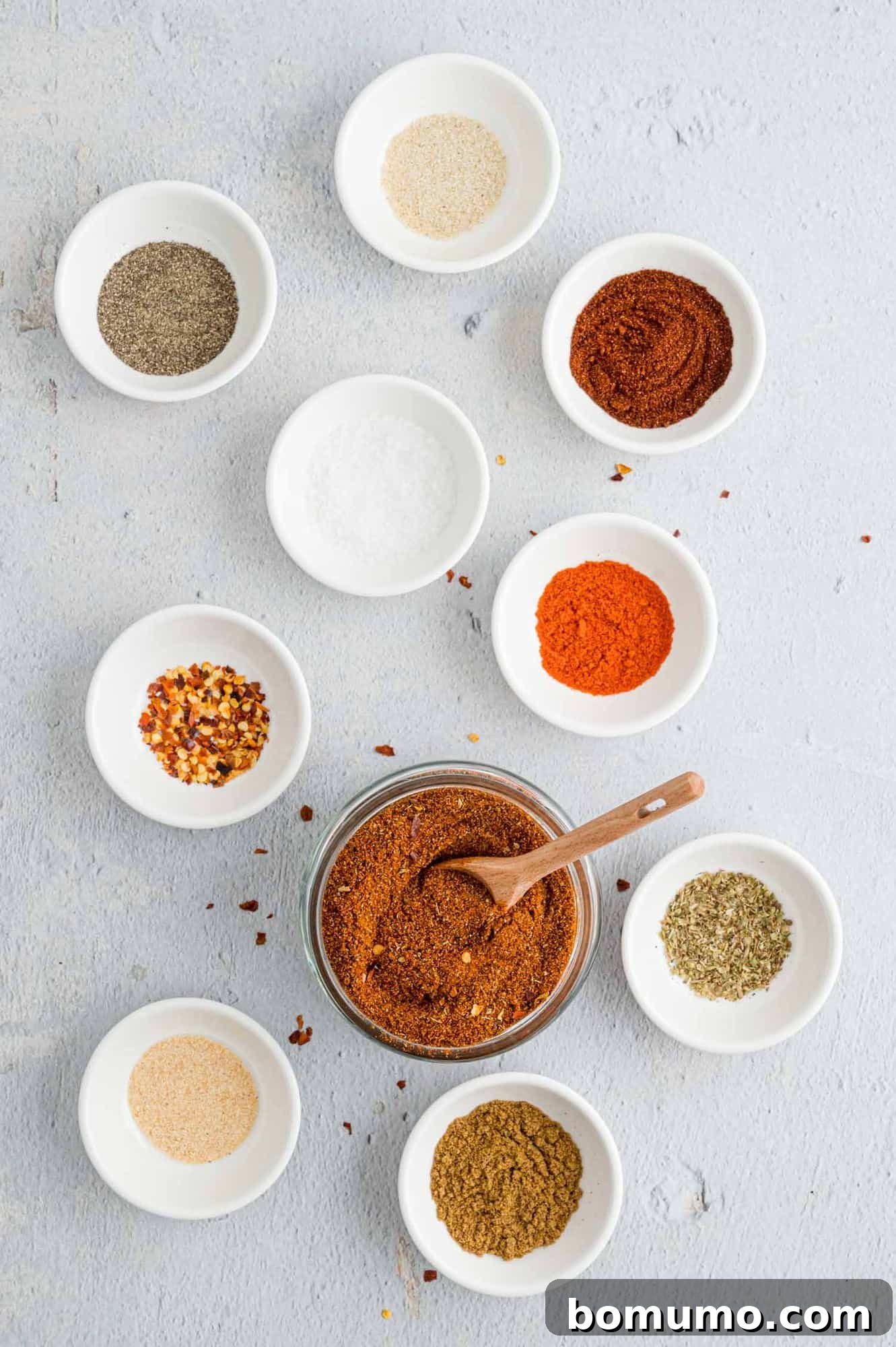 Taco seasoning ingredients in small individual bowls.