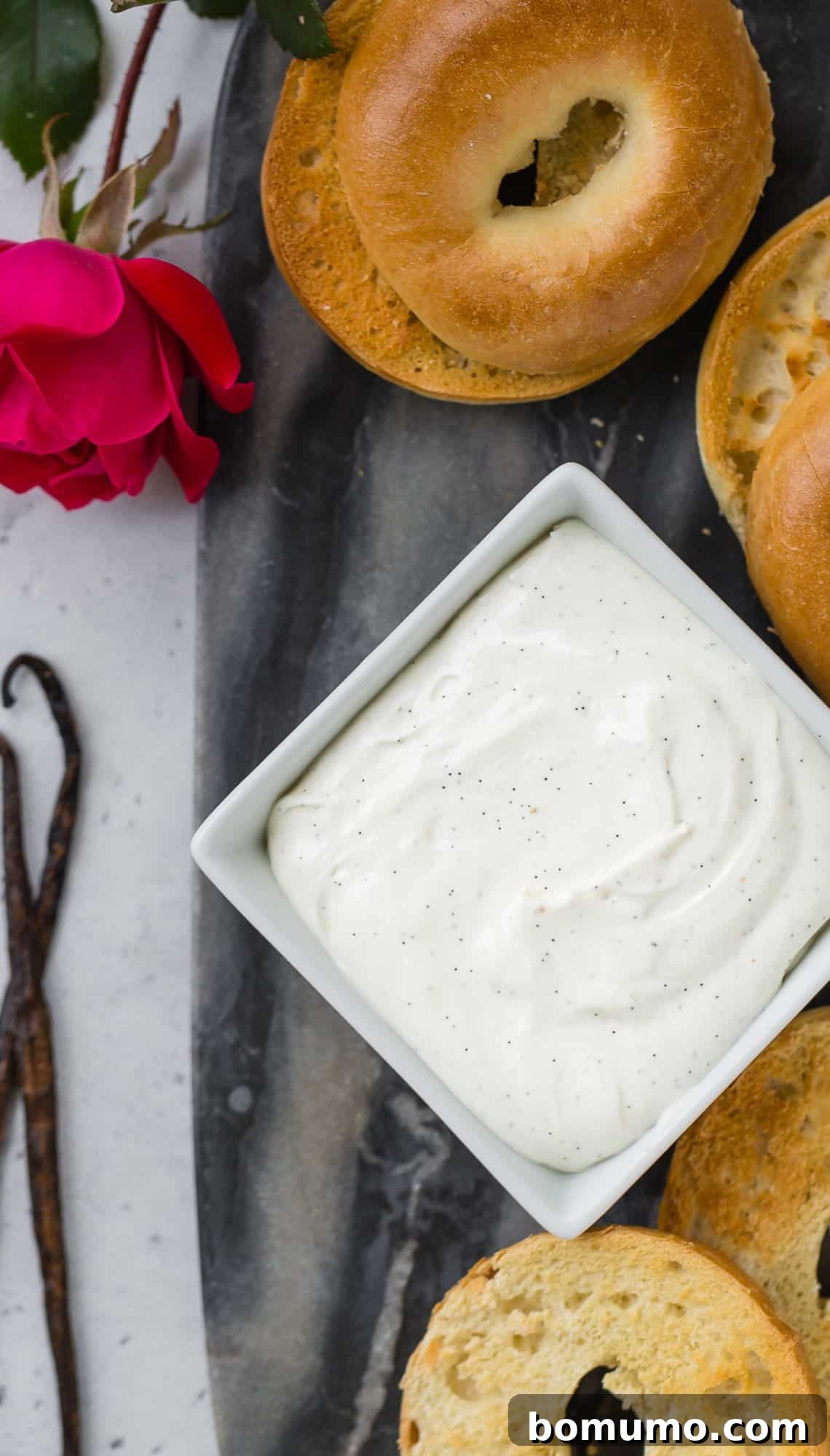 Vanilla bean whipped cream cheese in a square bowl, ready to be served.