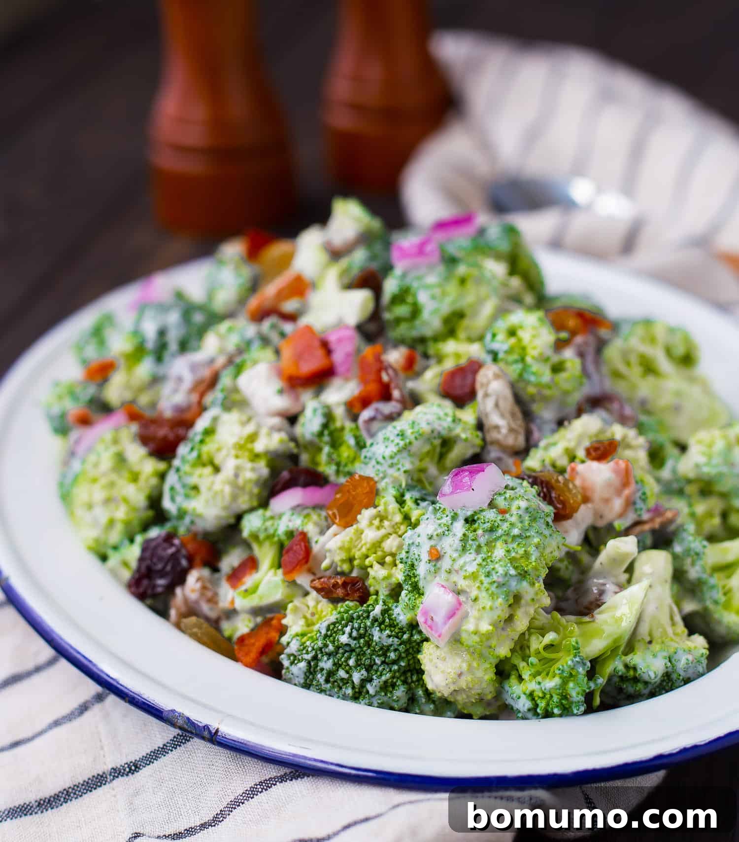 Broccoli salad served on a large platter, garnished and ready for guests.