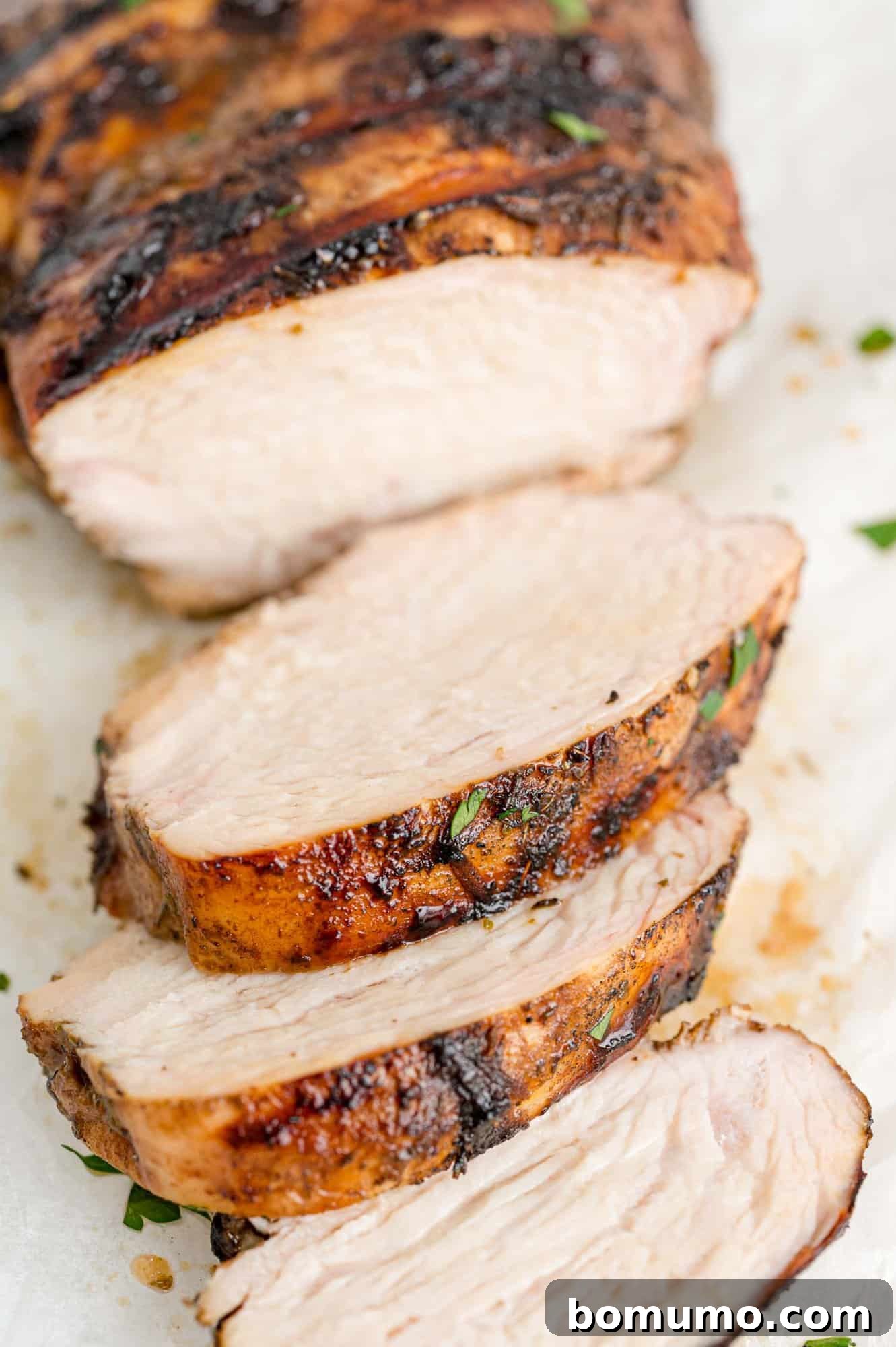 Perfectly sliced balsamic marinated chicken, ready to be served or added to a healthy meal.