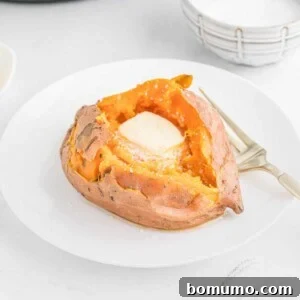 Instant pot sweet potato with butter melting inside it.
